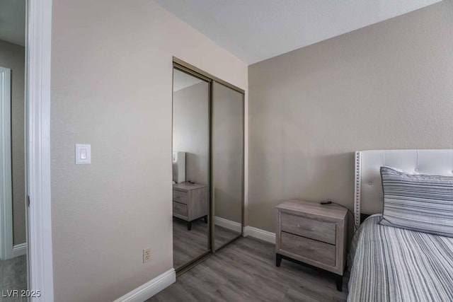 bedroom featuring hardwood / wood-style flooring and a closet