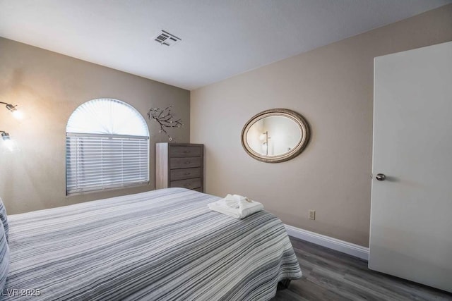 bedroom featuring dark wood-type flooring