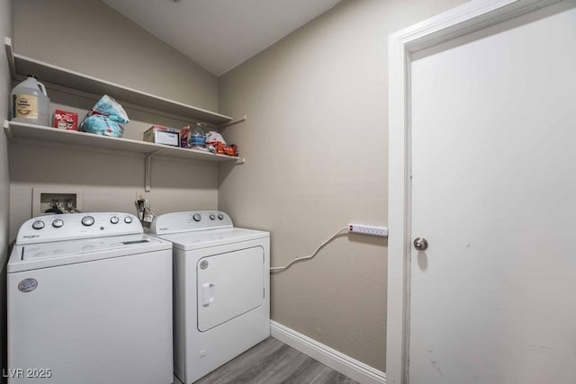 laundry room featuring dark hardwood / wood-style flooring and washing machine and dryer