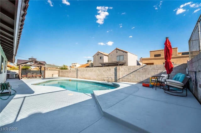 view of swimming pool featuring a gazebo and a patio area