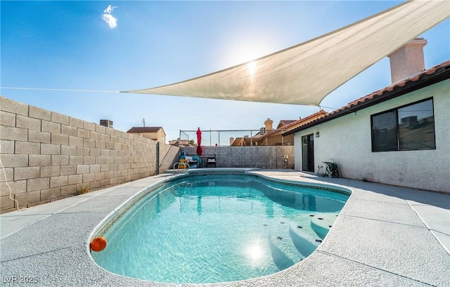 view of swimming pool featuring a patio