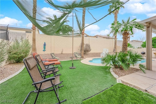 view of yard featuring a fenced in pool