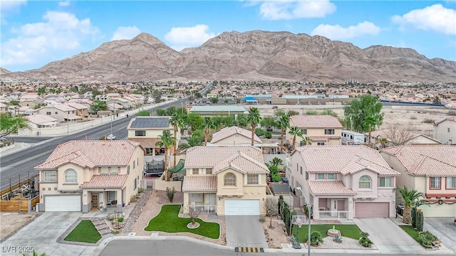 birds eye view of property featuring a mountain view