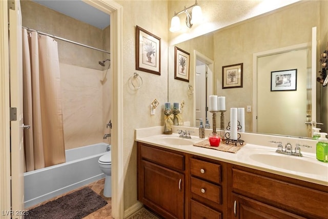 full bathroom with vanity, shower / tub combo with curtain, tile patterned floors, and toilet