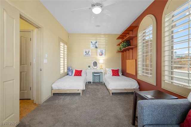 carpeted bedroom featuring ceiling fan