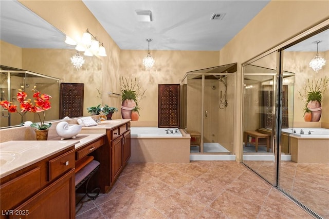 bathroom featuring vanity, shower with separate bathtub, and tile patterned flooring