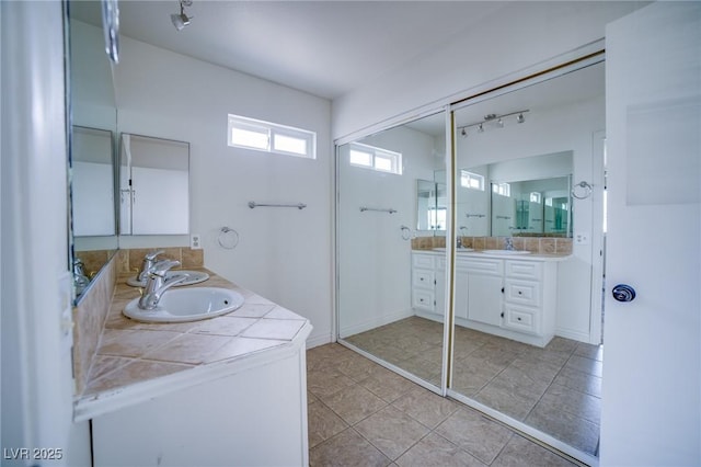 bathroom featuring tile patterned floors and vanity