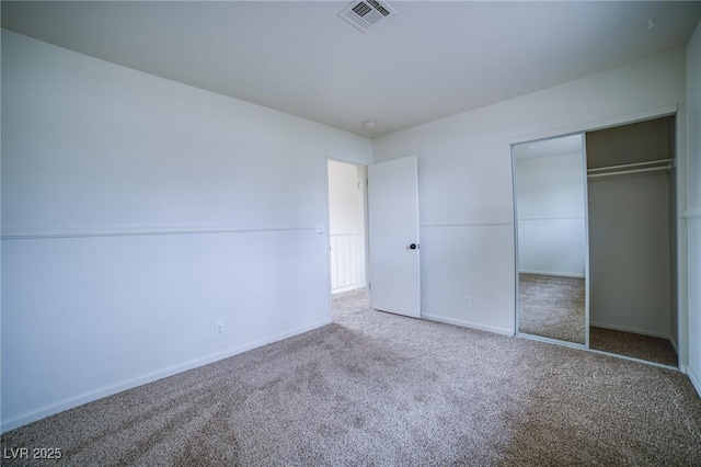 unfurnished bedroom featuring a closet and carpet