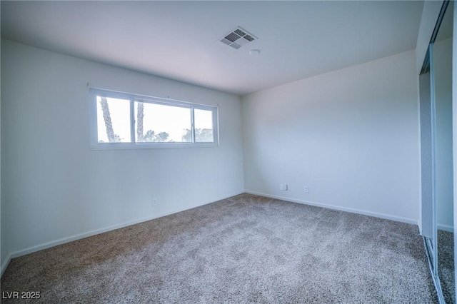 empty room featuring carpet flooring