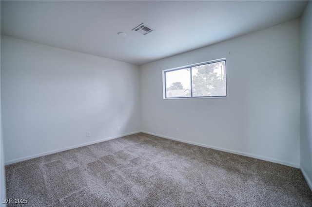 spare room with carpet floors