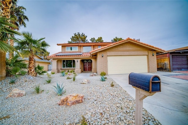 mediterranean / spanish-style house featuring a garage