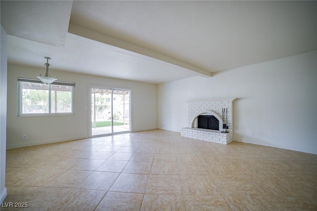 unfurnished living room featuring a brick fireplace, light tile patterned floors, and beam ceiling