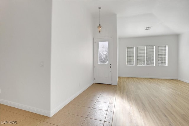 tiled foyer entrance featuring plenty of natural light