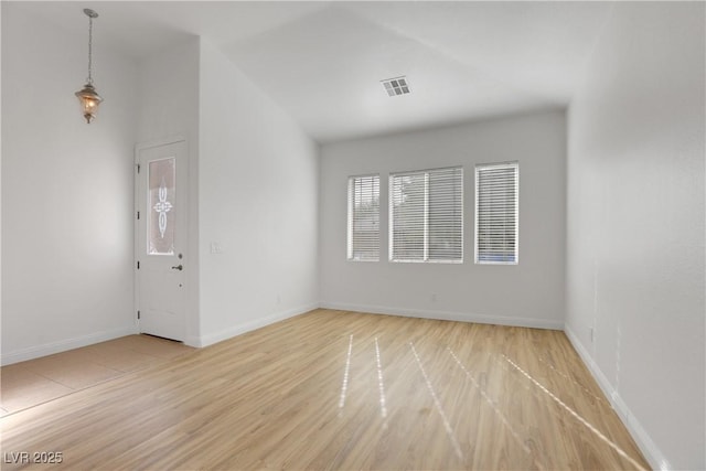 unfurnished room featuring light hardwood / wood-style floors