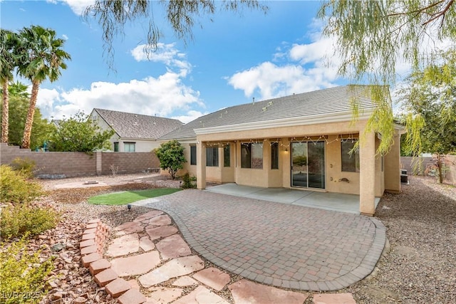 rear view of house with a patio