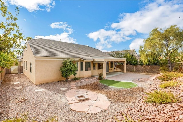 back of house featuring a patio