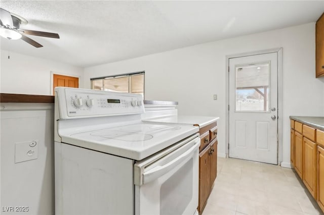 kitchen with ceiling fan and white range with electric cooktop