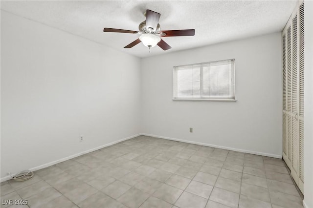 unfurnished bedroom with ceiling fan, a closet, and a textured ceiling