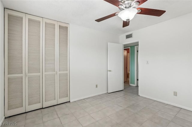 unfurnished bedroom featuring a closet and ceiling fan