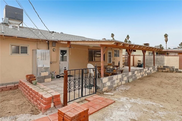 back of house featuring a patio