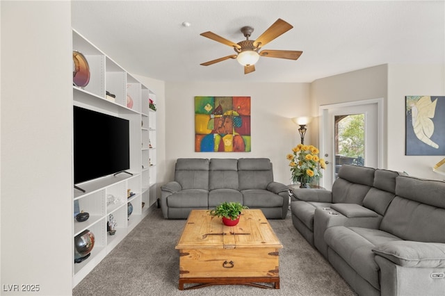 carpeted living room with ceiling fan