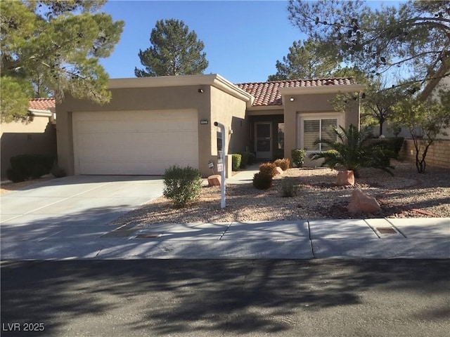 mediterranean / spanish home featuring a garage