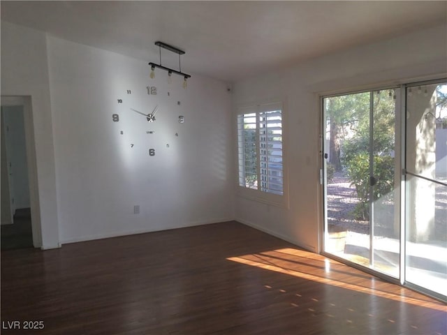 empty room featuring dark hardwood / wood-style floors