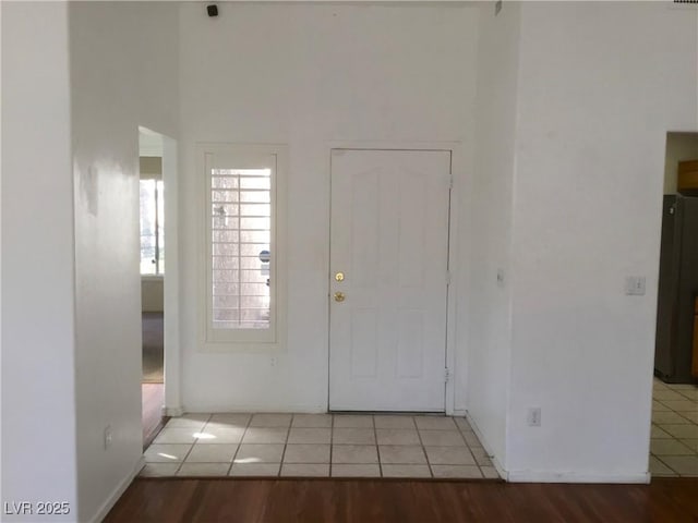 foyer featuring light tile patterned floors