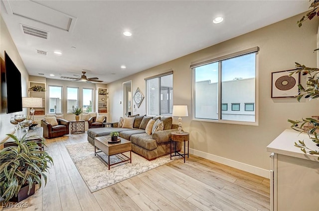 living room featuring plenty of natural light and light wood-type flooring