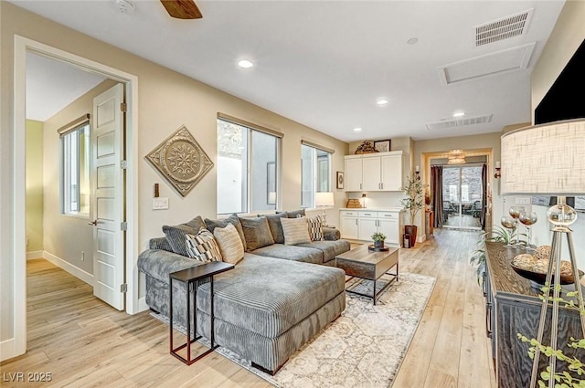 living room with light hardwood / wood-style flooring