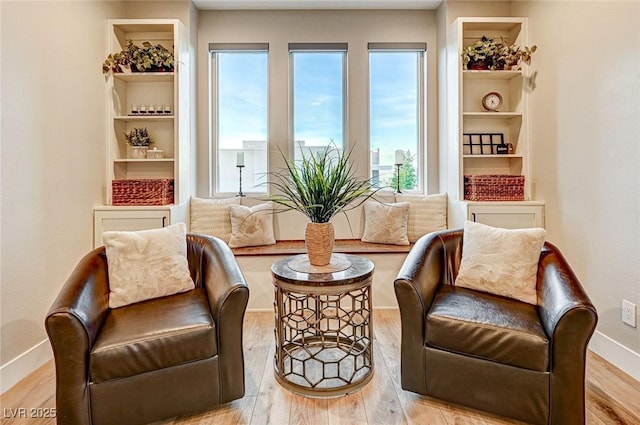 sitting room featuring light hardwood / wood-style floors