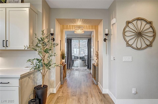 hallway featuring light wood-type flooring