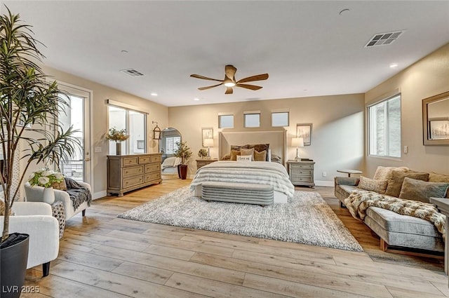 bedroom with ceiling fan, access to exterior, and light hardwood / wood-style flooring