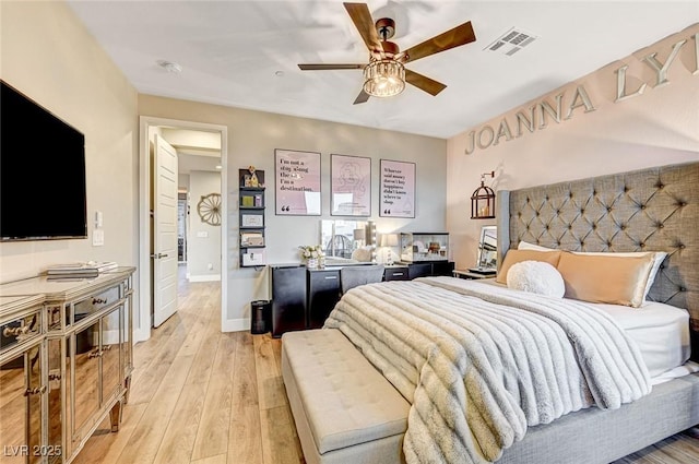 bedroom with light hardwood / wood-style floors and ceiling fan