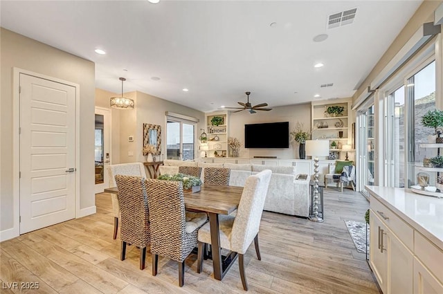 dining area featuring ceiling fan and light hardwood / wood-style floors