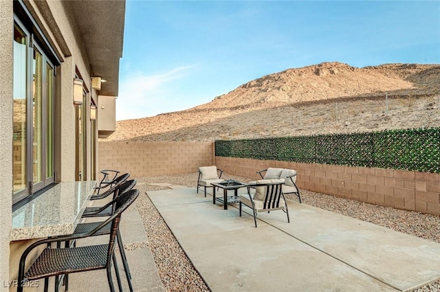 view of patio with a mountain view