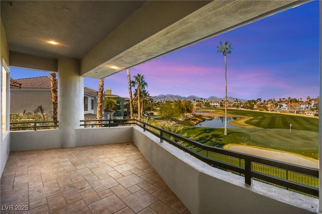 view of balcony at dusk