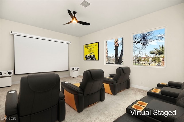 home theater featuring light colored carpet and ceiling fan