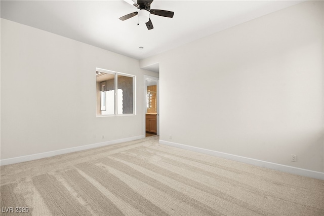 empty room with ceiling fan and light colored carpet