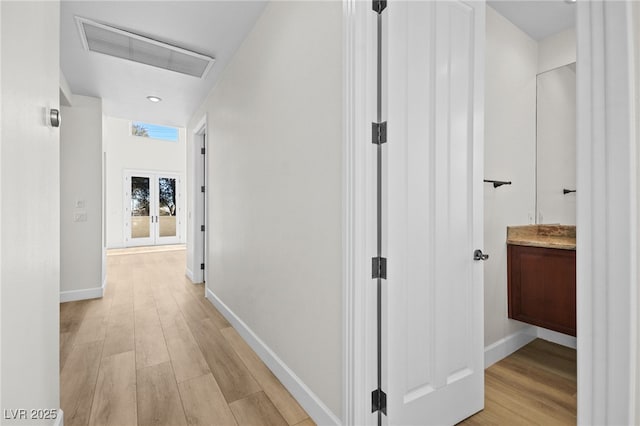 hall featuring light hardwood / wood-style flooring