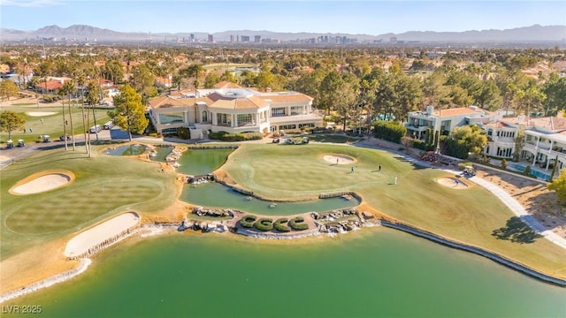 drone / aerial view featuring a water and mountain view