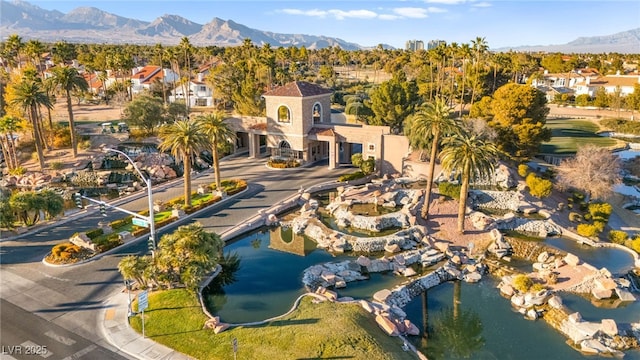 bird's eye view with a water and mountain view