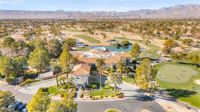 birds eye view of property featuring a water and mountain view