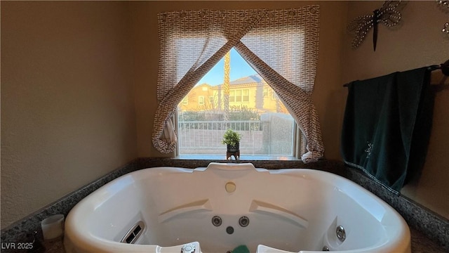 bathroom featuring a bath