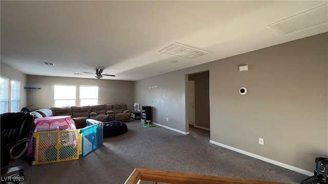 carpeted living room featuring ceiling fan and a healthy amount of sunlight