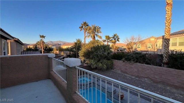 balcony featuring a mountain view