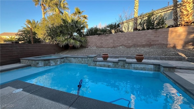 view of pool with an in ground hot tub