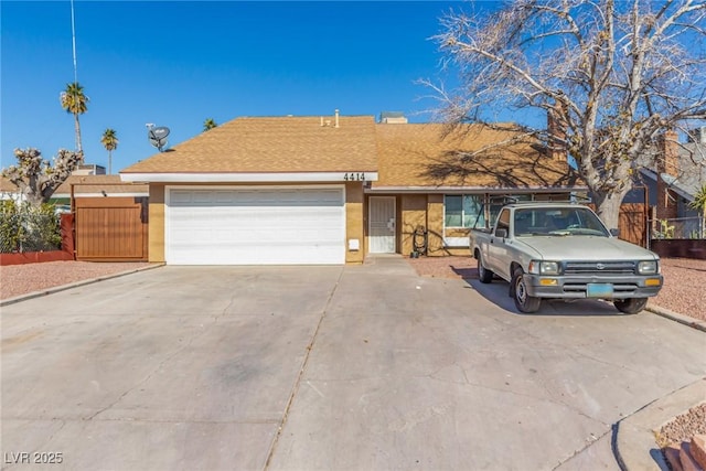 single story home with a garage