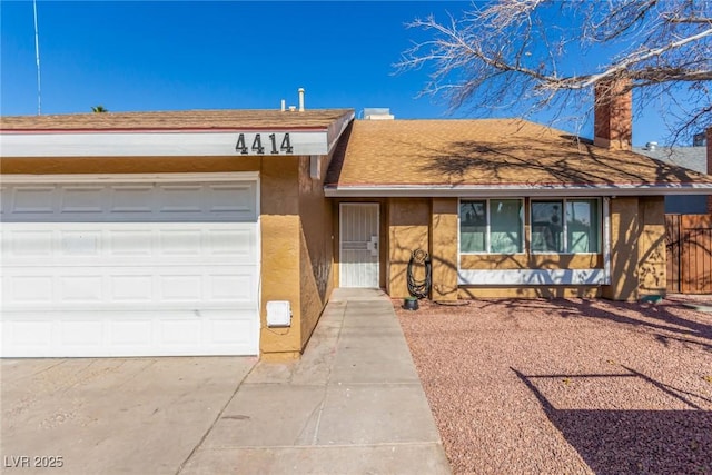 single story home with a garage