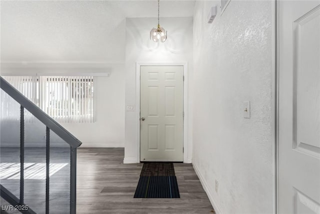 foyer with dark wood-type flooring